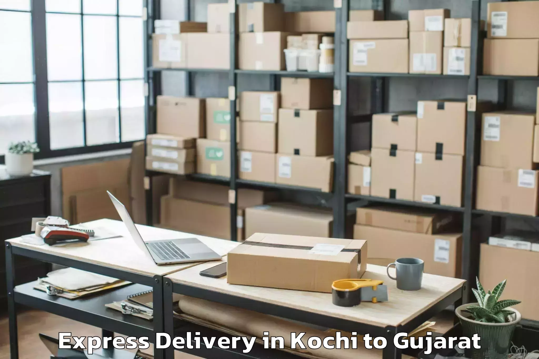 Get Kochi to Kodinar Express Delivery